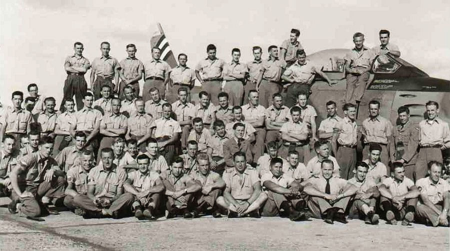 A Sabre surrounded by 416 Squadron groundcrew personnelat Rabat, French Morocco - Janvier 1956.jpg