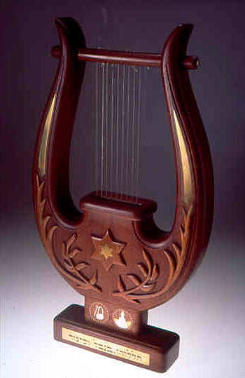 The lyre, or kinnor, like the harp, is frequently mentioned in the book of Psalms, as being a feature of the Levitical orchestra which performs in the Inner Courtyard of the Holy Temple..jpg